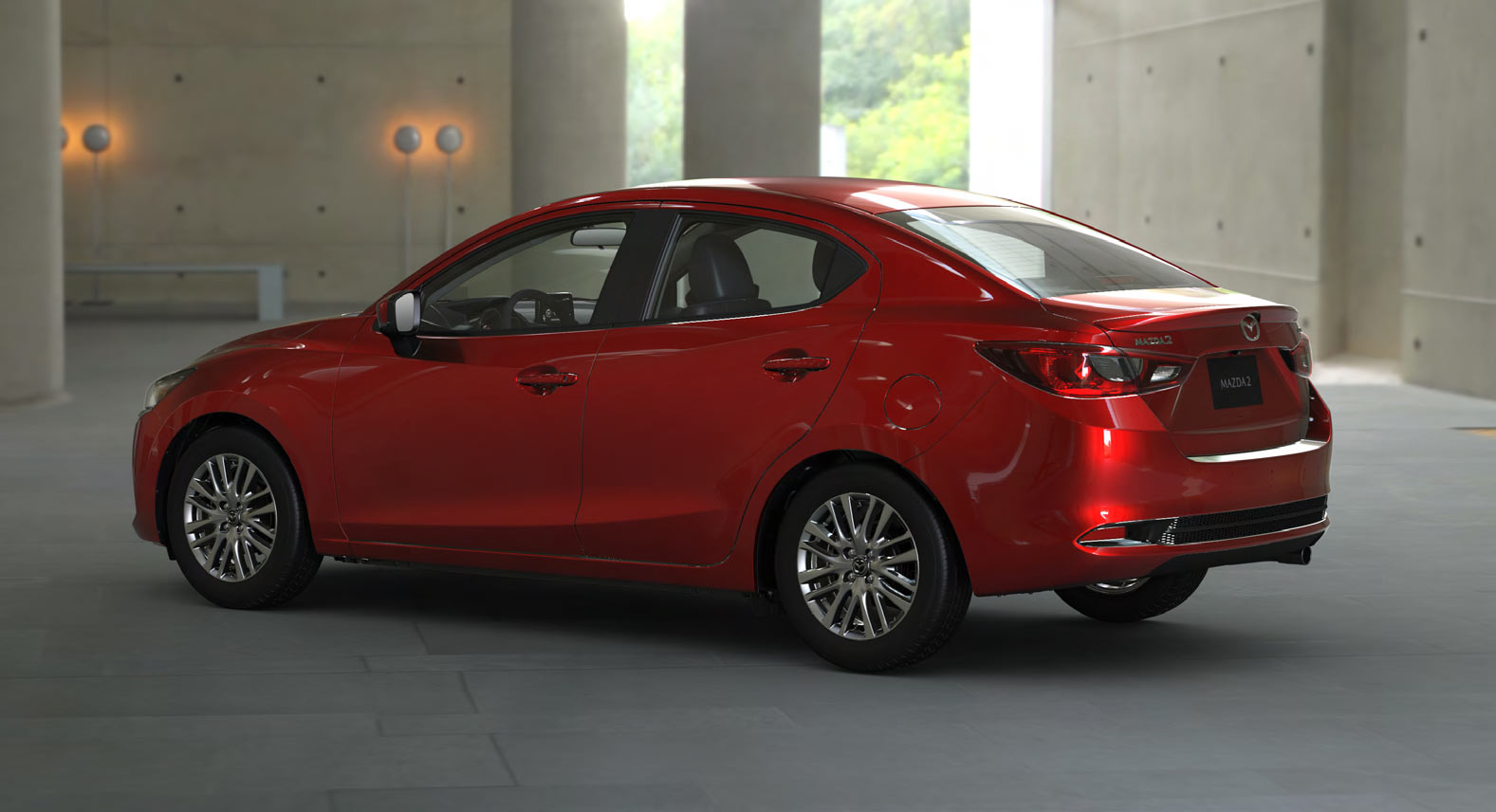 Mazda 2 sedán 2023 en México diseño exterior color rojo parte lateral y trasera