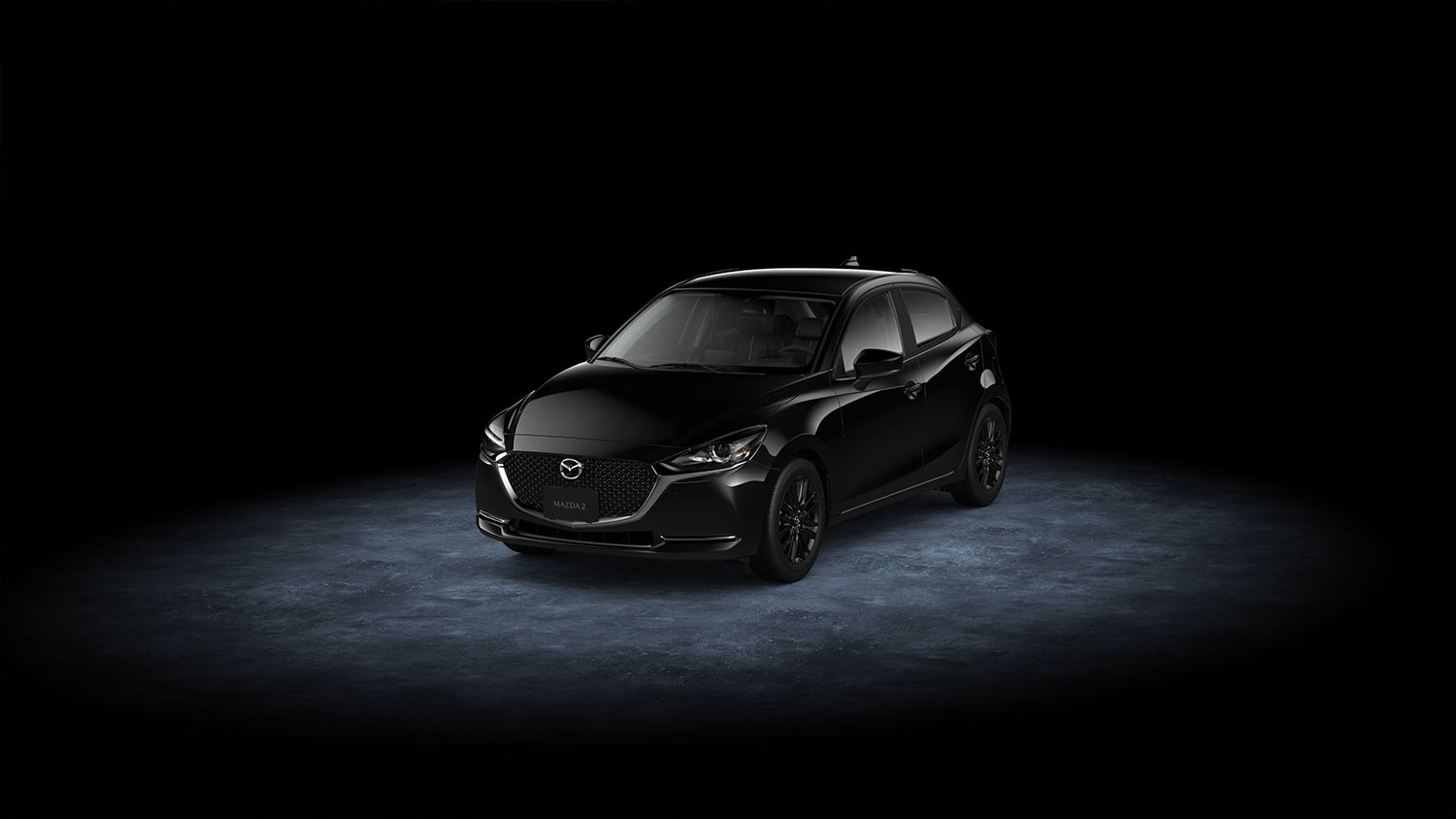 Mazda 2 hatchback 2023 en México Carbon Edition MHEV - color negro diseño frontal