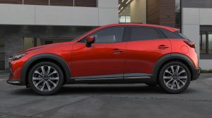Mazda CX-3 2023 en México color rojo lateral estacionado