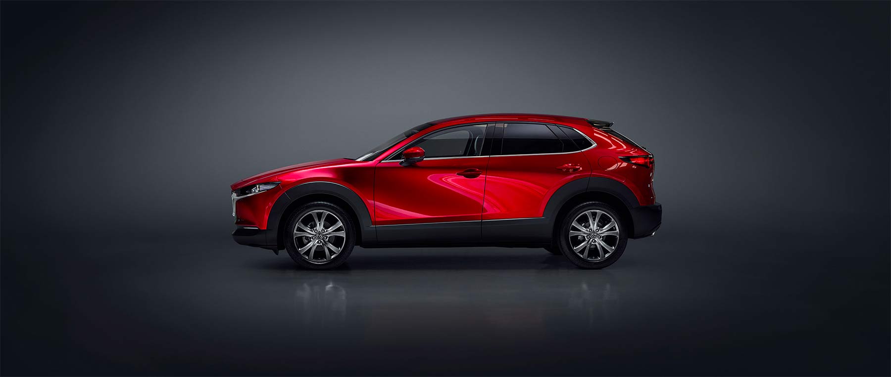 Mazda CX-30 2024 en México - exterior color rojo, lateral, rines