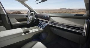 Hyundai Santa Fe 2025 interiores - volante, consola, tablero, pantallas - vista lateral